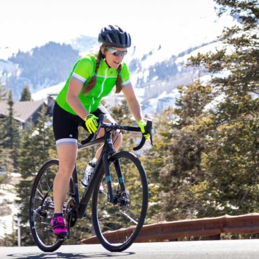 Road cyclist riding near Park City during Spring