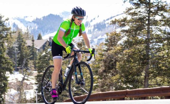 Road cyclist riding near Park City during Spring