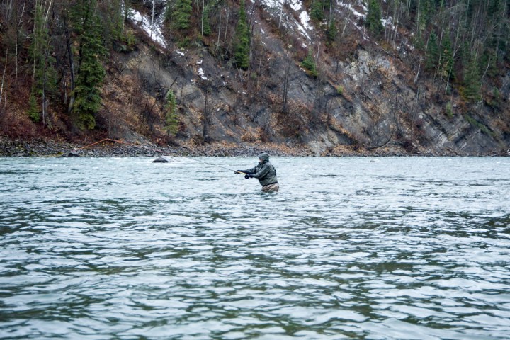Fisherman fishes in the water