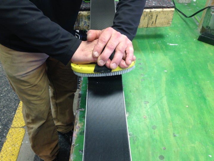 Brushing old wax out of ski base structure