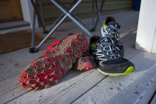 Muddy Running shoes on a porch