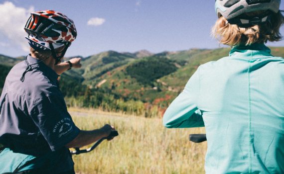 Cyclists look out over views of Park City's historic Old Town