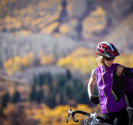 cyclist demonstrates how the sleeves of this jacket can be zipped off, making it into a vest