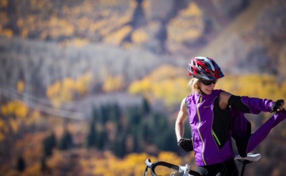 cyclist demonstrates how the sleeves of this jacket can be zipped off, making it into a vest
