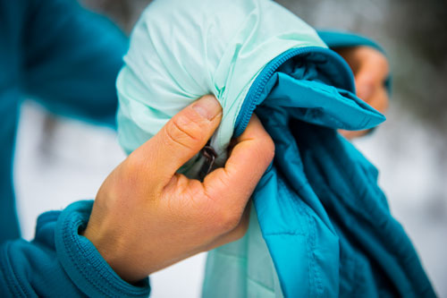 A nano puff jacket is packet into its own pocket