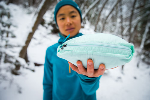 showing how the nano puff jacket packs into a pocket