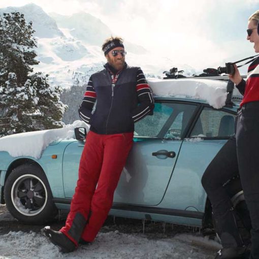 Couple stands next to car wearing Bogner apparel