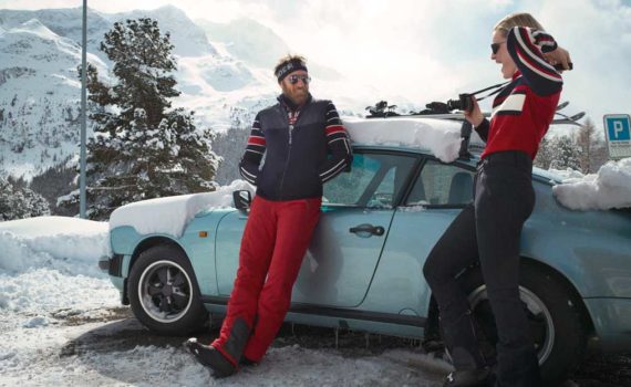 Couple stands next to car wearing Bogner apparel