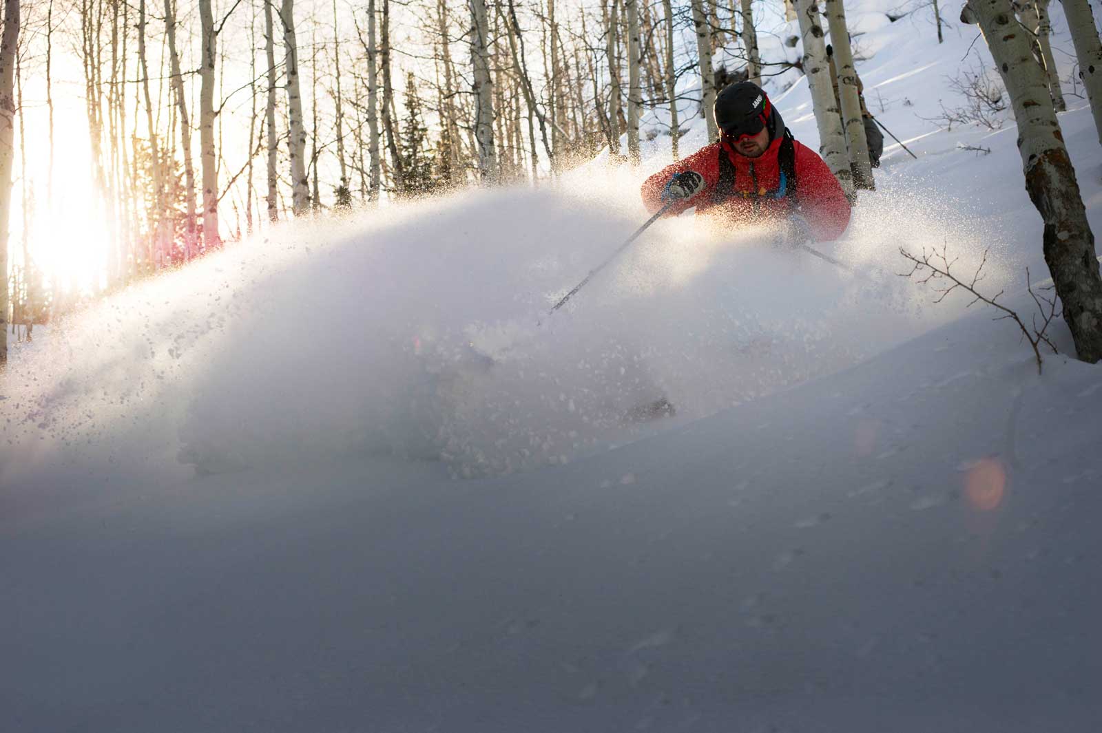 Skier makes a turn in deep powder