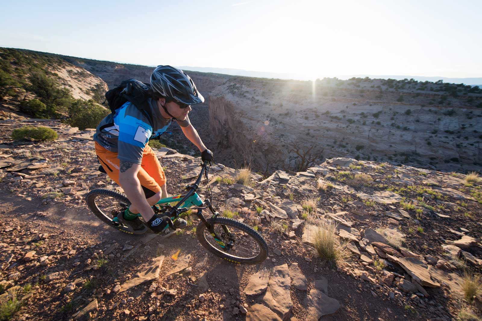 A single mountain biker on the Good Water Rim trail in Utah