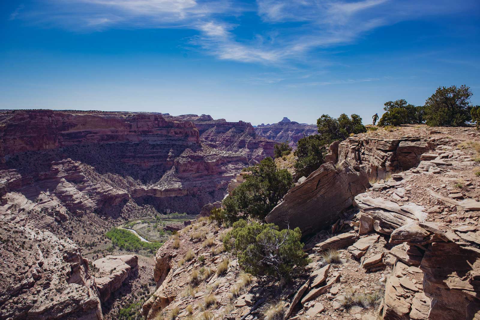 A single mountain biker on the Good Water Rim trail overlooking the San Rafael Swell