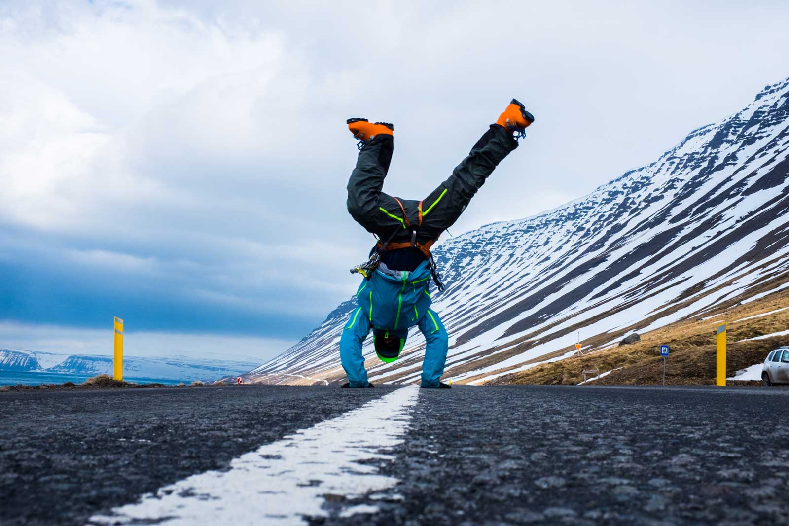 Skier doing a cartwheel in ski boots near Isafjordur, Iceland