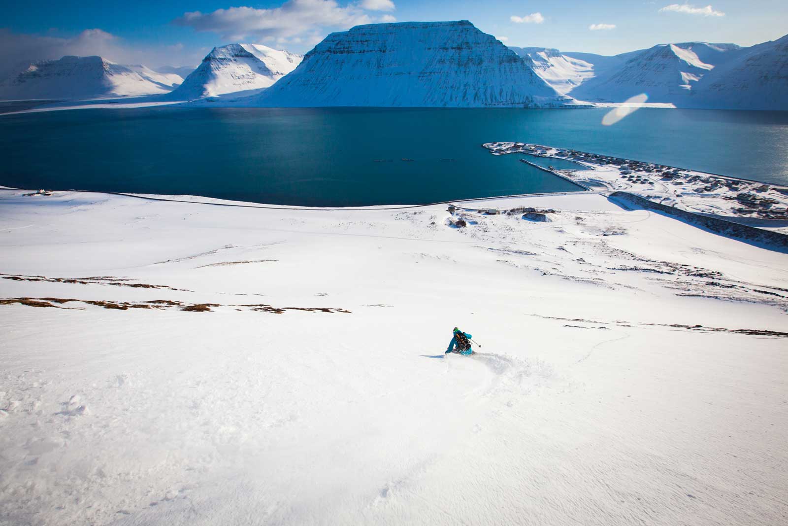 Skiing toward the ocean near Flateyri, Iceland
