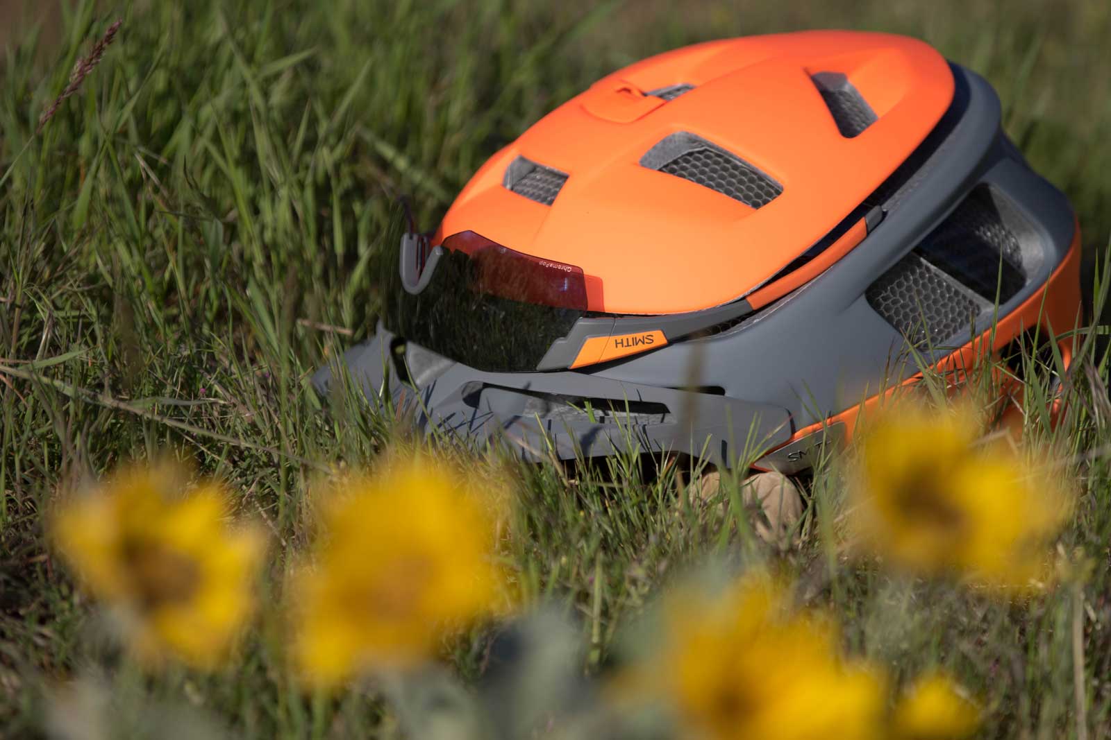 Smith Optics sunglasses integrated to the top of the Forefront helmet on the grass