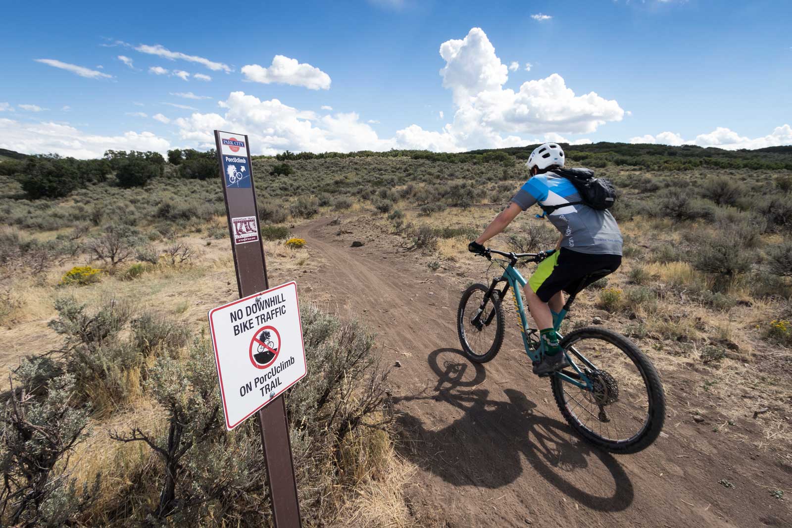 A mountain biker at the beginning of the PorcUclimb trail in Park City, UT