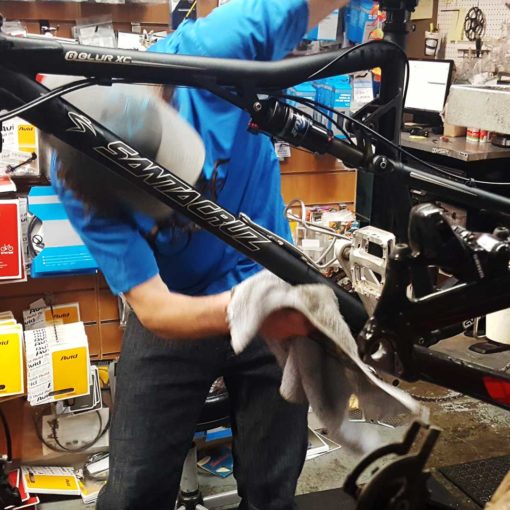 Bicycle mechanic repairing a mountain bike