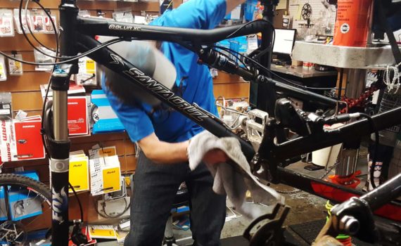 Bicycle mechanic repairing a mountain bike