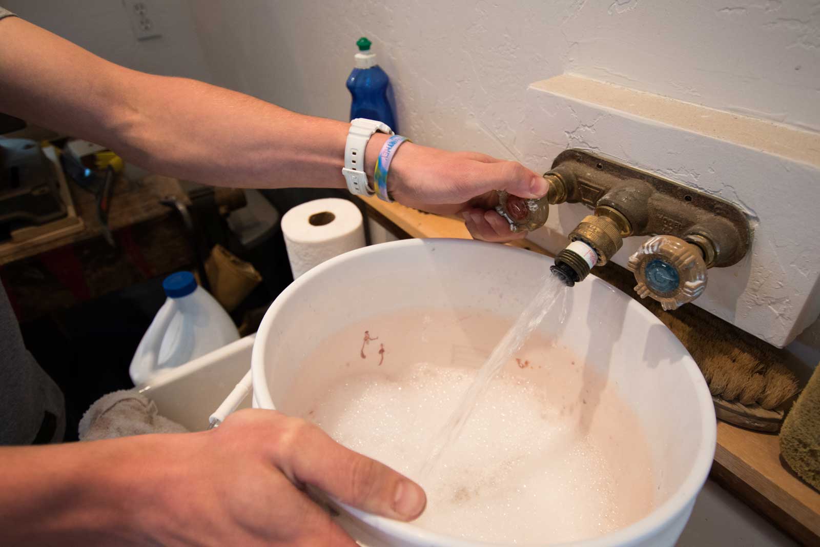 A bucket filled with warm soapy water