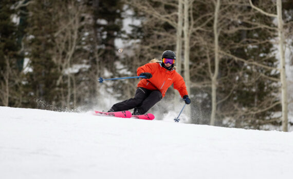 An alpine skier carves a turn on a groomer at Deer Valley Resort in Utah