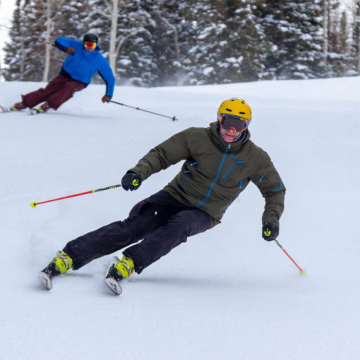 Two skiers carving turns at Solitude Resort, UT