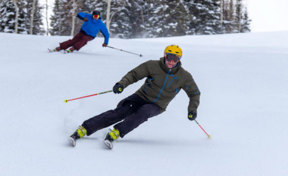 Two skiers carving turns at Solitude Resort, UT