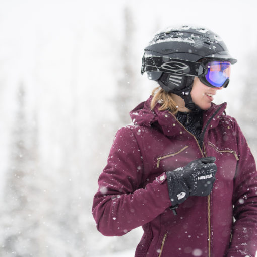 Kendall zipping up ski jacket on the slopes in Park City, Utah