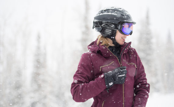 Kendall zipping up ski jacket on the slopes in Park City, Utah