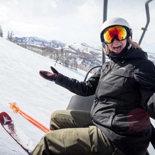 Jans employee rides ski lift with friend at Deer Valley.