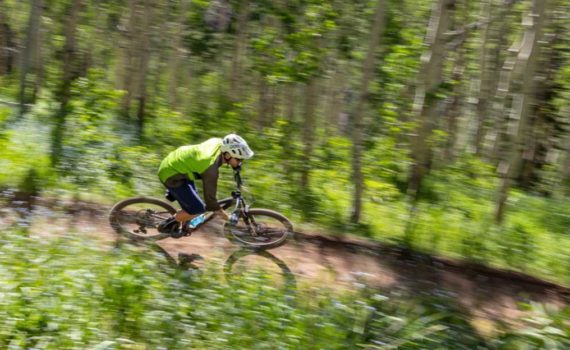 Jans employee, Paul Boyle, mountain bikes in Park City, UT.