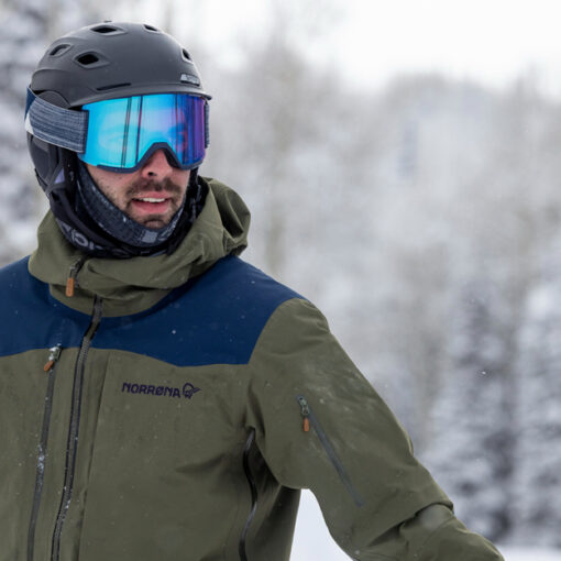 A skier wearing a Norrona Lofoten Gore-Tex jacket admires the view during a powder day at Deer Valley resort in Park City, UT.