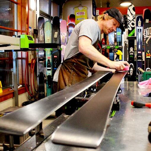 Derek Dehaas puts the final touches on a ski tune at Rennstall