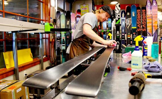 Derek Dehaas puts the final touches on a ski tune at Rennstall