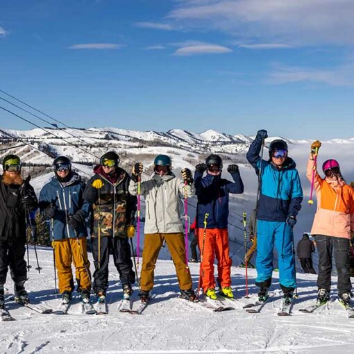 Jans Expters take a group phto together with arms raised while ski testing at Deer Valley Resort, Park City, UT