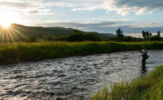 Jans fly fishing guide demonstrating good casting technique on a river near Park City, UT