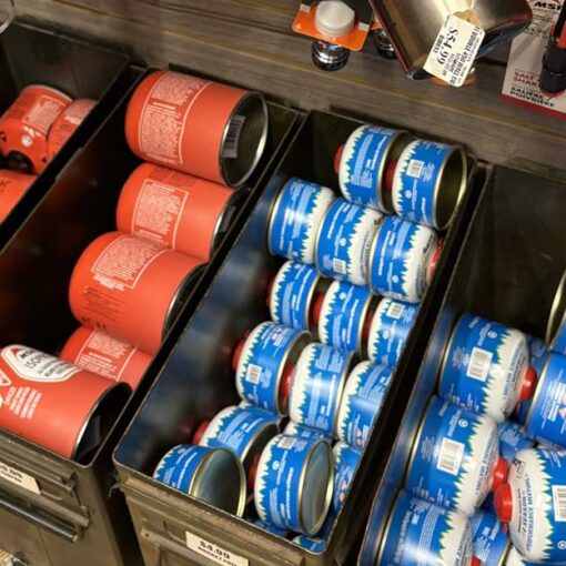 Bins of canister fuel used for backcountry stoves.