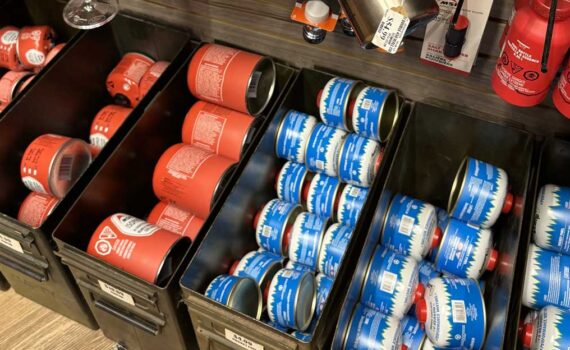 Bins of canister fuel used for backcountry stoves.