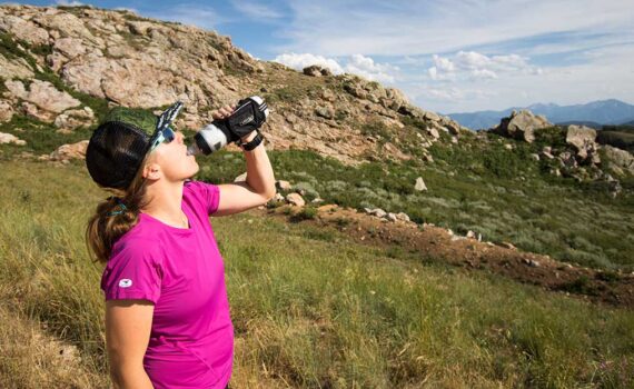 Jans Expert breaks for some quick hydration while on a trail run in the Wasatch Mountains