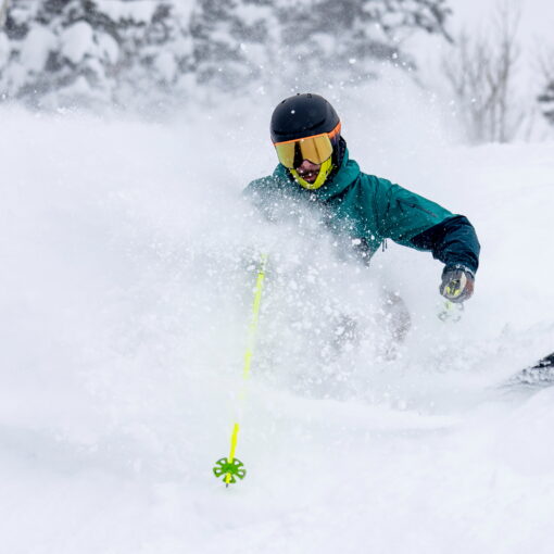 Jans Expert blasts through a powder wave with chrome lenses.