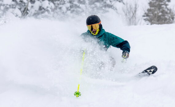 Jans Expert blasts through a powder wave with chrome lenses.