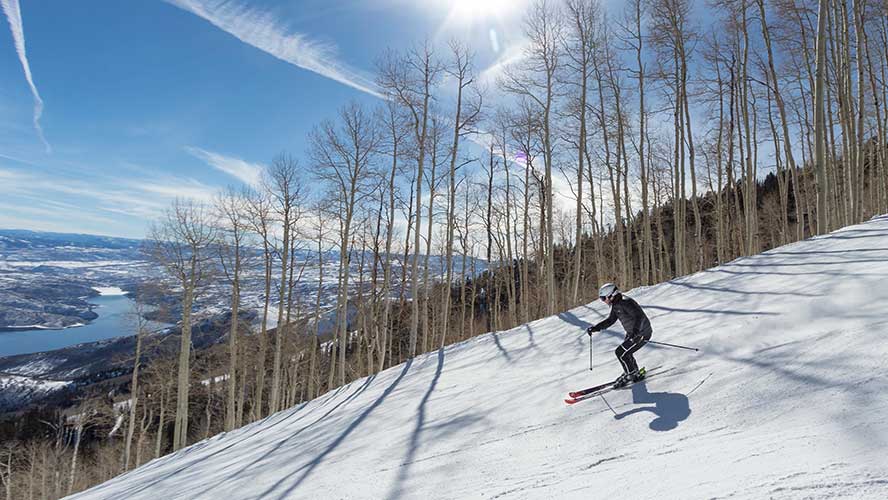 A skier skiing on high-performance ski package at Deer Valley Resort, Park CIty, UT